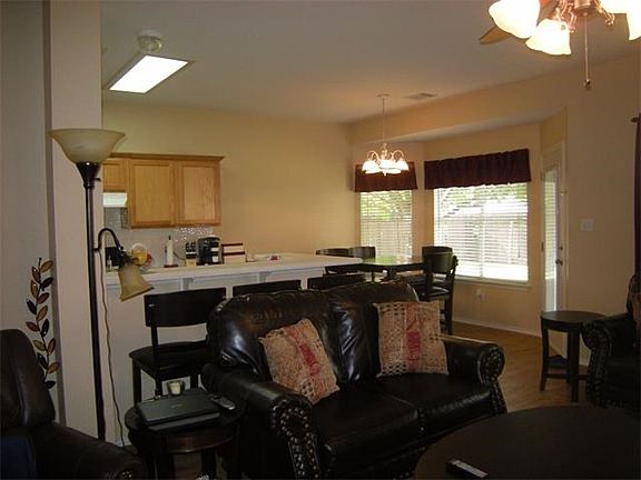 Breakfast bar separates the living room from kitchen & dining area