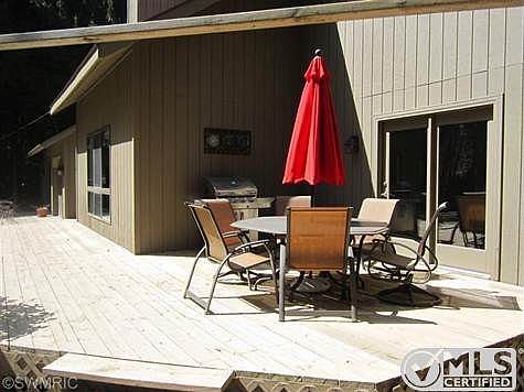 Large deck overlooking private property.