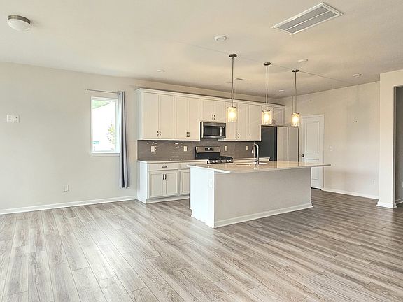 Living, dining and kitchen area