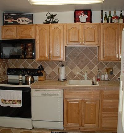 kitchen- ceramic tile floor, counter & backsplash