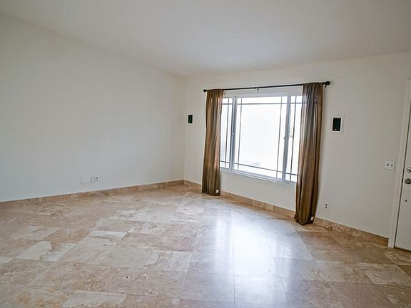 Great living room with tile travertine floors, wir