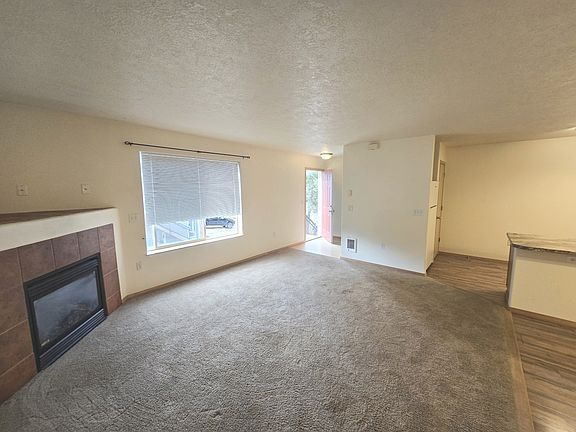 Living room with gas fireplace.