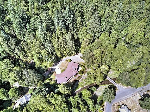 The entry is off of the paved road in the bottom right of the shot (and over Finch Creek on the bridge), and the property goes up the hill behind quite a ways. The bridge was recently cleared to safely handle 40,000 pounds... 