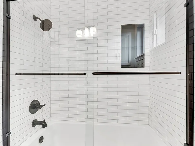 New tub & shower with glass enclosure