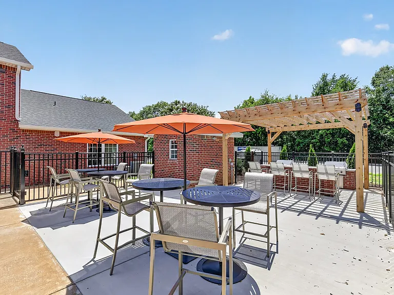 Grilling patio and pergola at Saddlebrook Apartments in Murfreesboro, TN, offering a welcoming space for residents to gather.