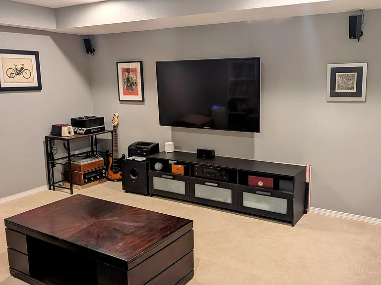 Media room with attached full bath. Can be repurposed as a guest suite.