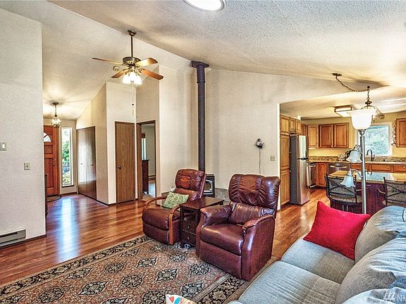Enter the home to find updated laminate flooring and vaulted ceilings.