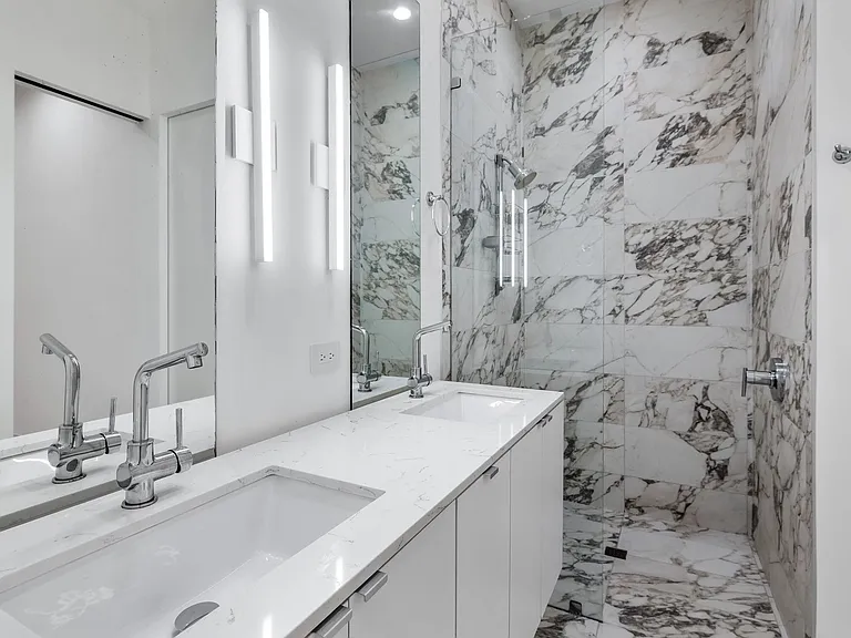 Dual vanity with integrated sinks and chrome fixtures