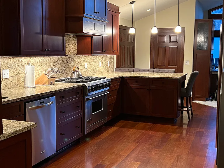 Granite full backsplash. A dream Chef's kitchen.