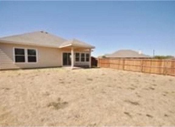 Back yard with covered porch