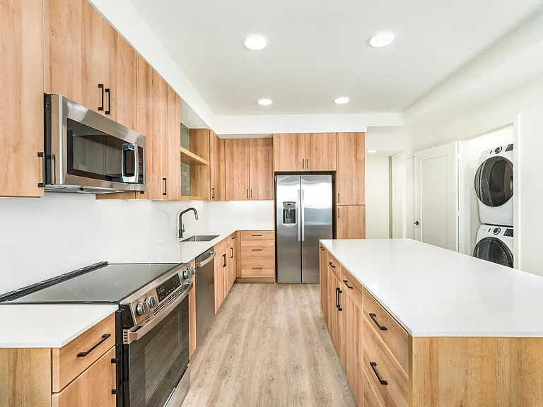 Quartz countertops, soft-close cabinets, and ENERGY STAR_ appliances make cooking effortless.