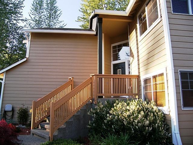 Front entry with lush greenery