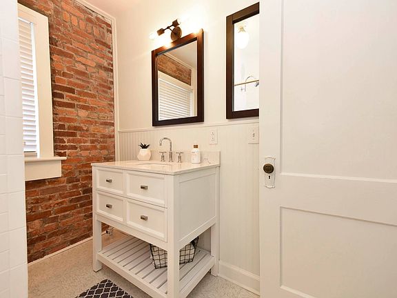 Exposed Brick and custom Bathroom Accents