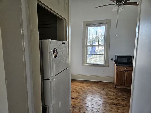VIEW FROM FRONT ROOM LOOKING INTO THE KITCHEN