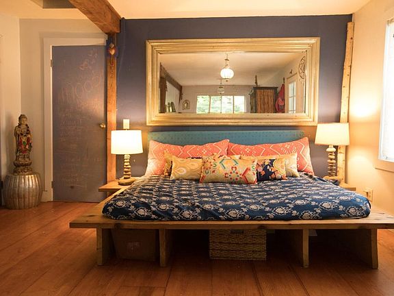 custom built cedar daybed and antique silver mirror in the l