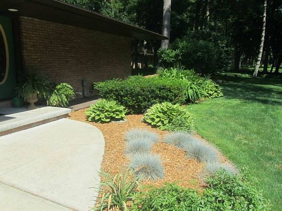 Beautiful landscaping greets you.br /br / 