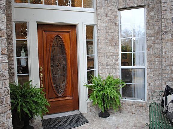 Elegant Covered Porch Welcomes Your Guests