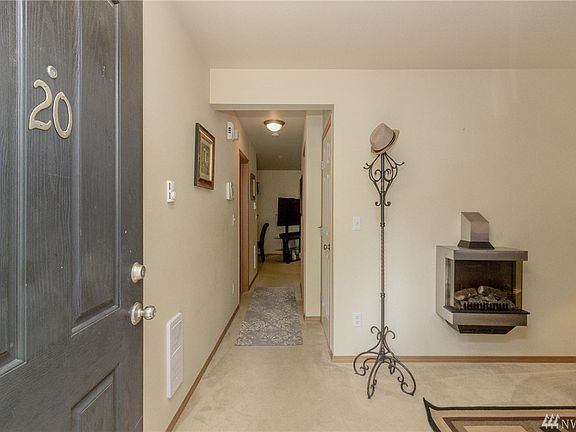Welcoming entry invites friends and family into your home and cozy living room, office or den, whichever you prefer! Love the electric fireplace, just flip a switch on those winter days!
