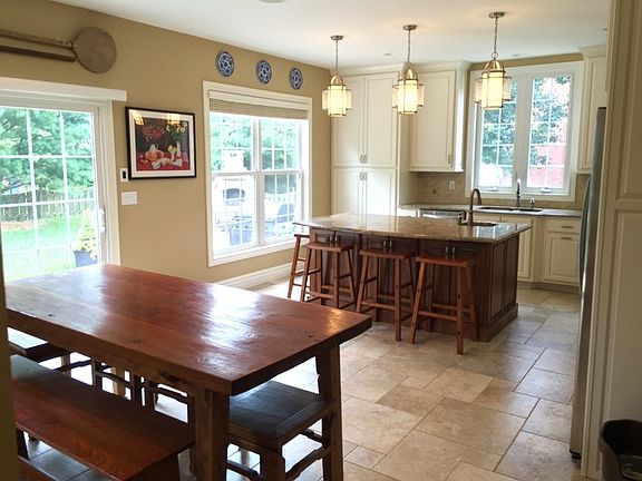 KITCHEN WITH LARGE ISLAND AND 2 BUILT IN OVENS. ONE GAS ONE ELECTRIC