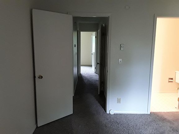 Master Bedroom with view of hallway to 2 additional bedrooms