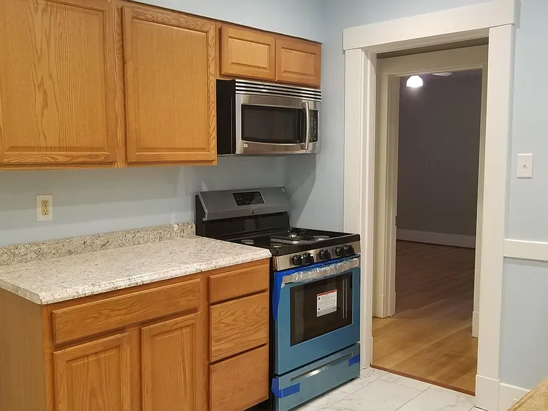 View of kitchen, new gas stove.
