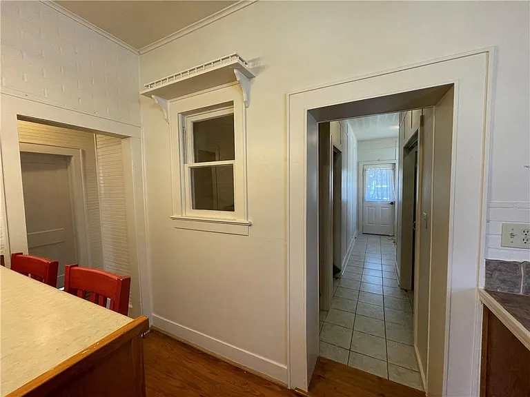 Hallway off Kitchen Leading to Upstairs, Laundry and Back Entrance.