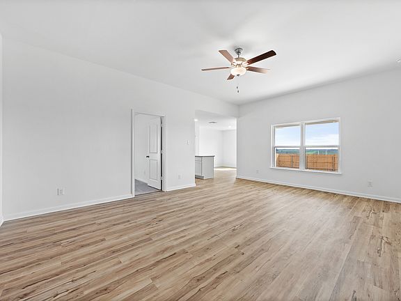 The family room has a large window to let in natural light