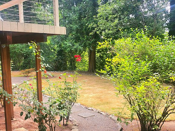 Private gravel path leading to backyard and entrance.