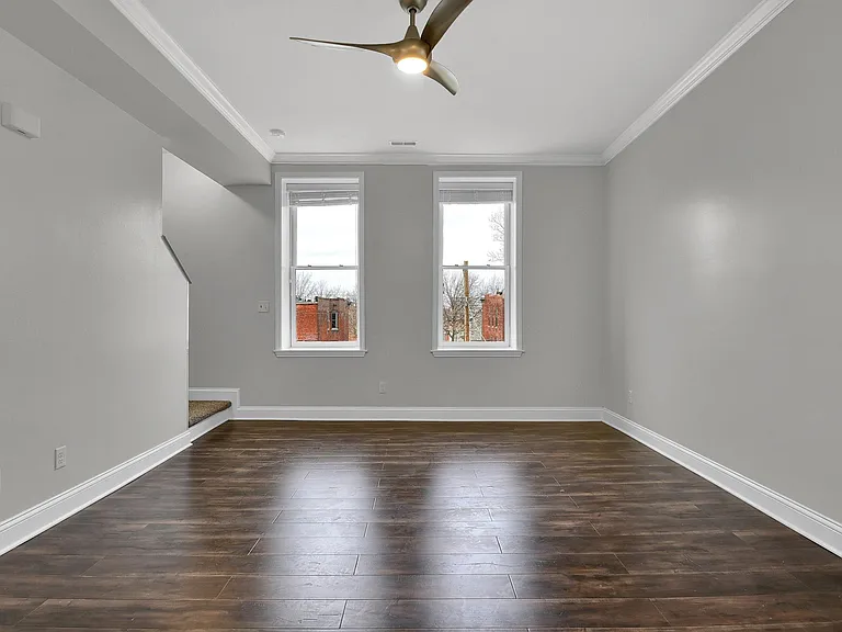 Family Room - level 1: Look at all the natural light! 10' ceiling, beautiful hardwood floors, elegant contemporary ceiling fan, venetian blinds, crown moulding