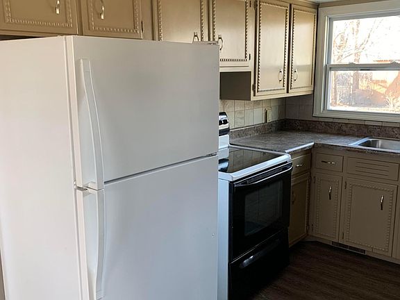 Kitchen includes Refrigerator, Oven Range, Dishwasher, and Garbage Disposal.