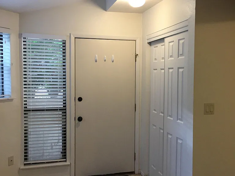 Entryway closet and behind-the-door hooks.
