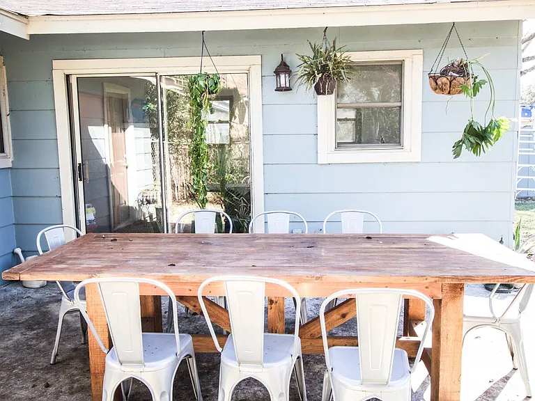 Through the sunroom you can enter to the patio and a large fully fenced in backyard with two pecan trees and storage space.