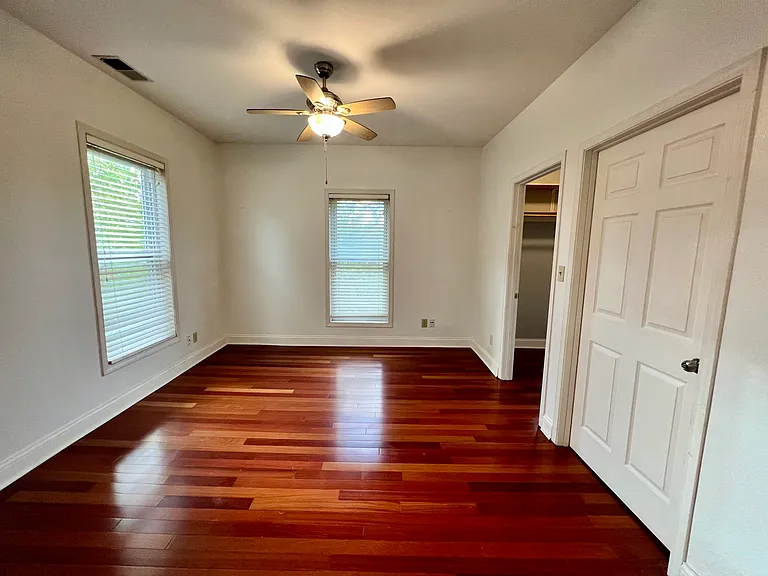 primary bedroom. Room has 3 windows and overlooks the rear yard.