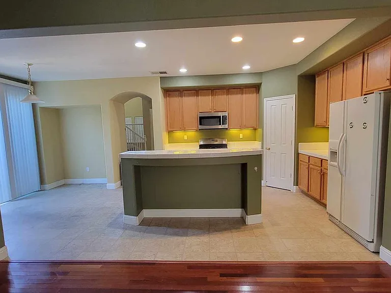 Kitchen as seen from large, back livingroom