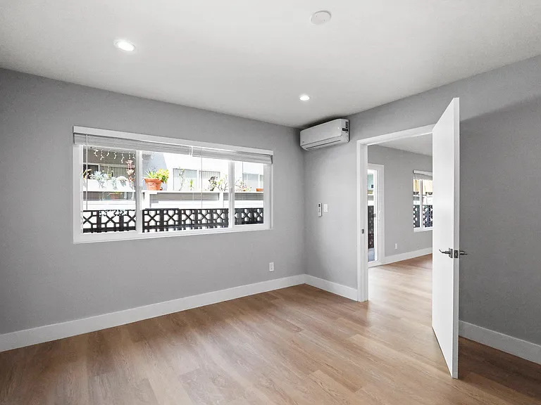 Bedroom with Vinyl Flooring, Recessed Lighting, and Large-Size Windows