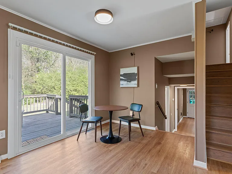 Cozy dining area with access to outdoor deck