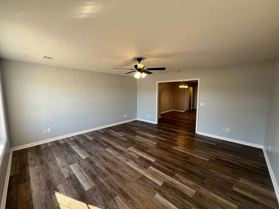 Nice size living room with new flooring and new paint. You will be amazed at how much room is in this house.