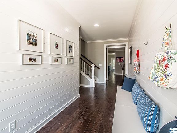 The beautiful double front doors and foyer invite you into the home.
