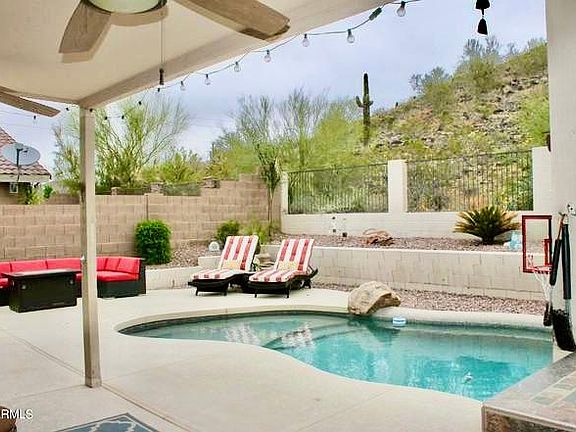 Pool, waterfall, play area and BBQ island with grill and kegerator
