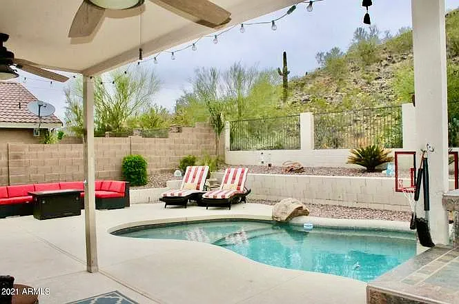 Pool, waterfall, play area and BBQ island with grill and kegerator