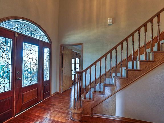Beveled Leaded glass front door welcomes you at the entry.