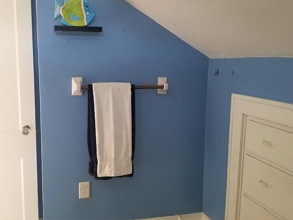 Bathroom includes built in drawers and extra storage.
