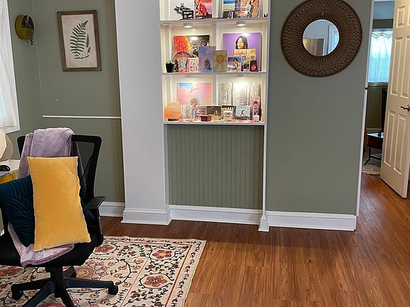 Custom Inset Shelves - Prior Tenants Decorations. Note the cool as f vaulted ceiling lines and crown molding