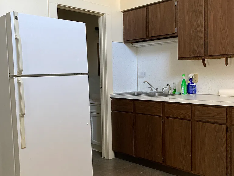 view on the kitchen with entrance to bathroom.