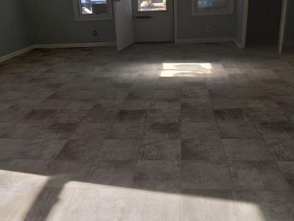 Standing in kitchen doorway looking into 18x20 living room