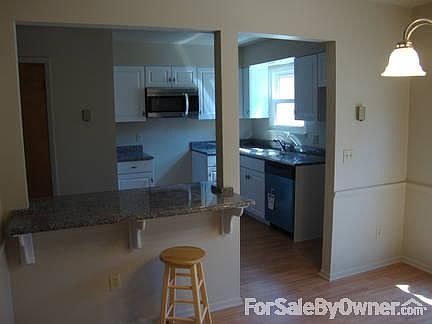 Kitchen from Dining Room
						:
						new cabinets, floor, granite counter tops, microwave, and dishwasher (stainless)