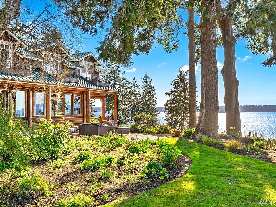 60 feet of High Bank Puget Sound Waterfront Home, separate cottage, studio and 3 tax lots. 