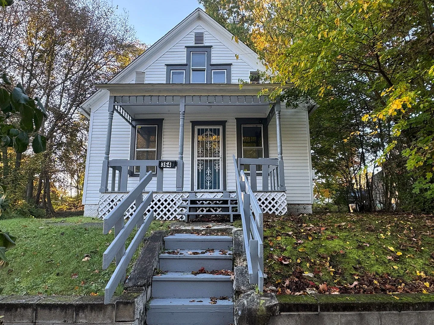Charming 3-Bedroom Akron Home with Full Basement, Covered Porch & Flexible Living Space! — Photo 1