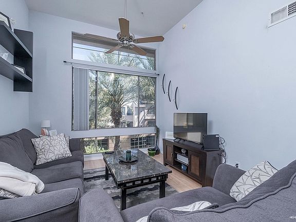 Living w/floor to ceiling Windows