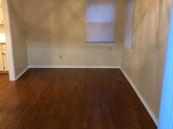 Dining with updated fixture, new windows all over the home and new miniblinds